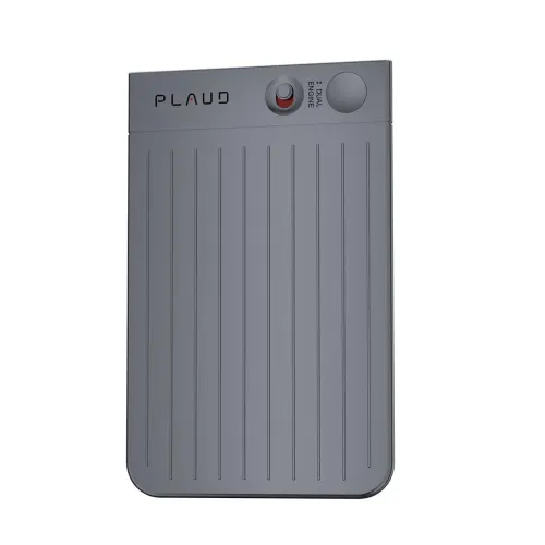 Voice recorder from Plaud with gray metal front, vertical grooves and round knob at the top and button with the text Dual Engine.